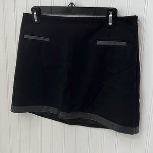 Express mini skirt zips up the side to front leather detailing